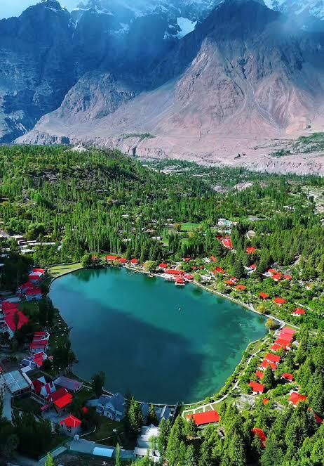Boating on Shangrila Lake surrounded by pine slopes, Skardu Gilgit-Baltistan